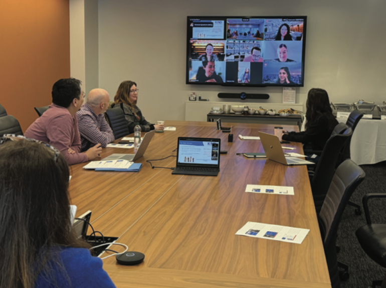 SIJS cohort volunteers meeting to discuss the status of their cases. [cite: 153]